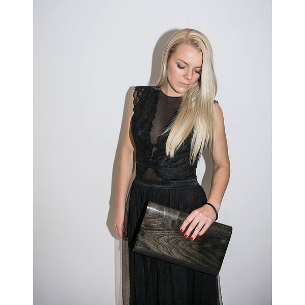 Clutch made of shiny black wood and leather